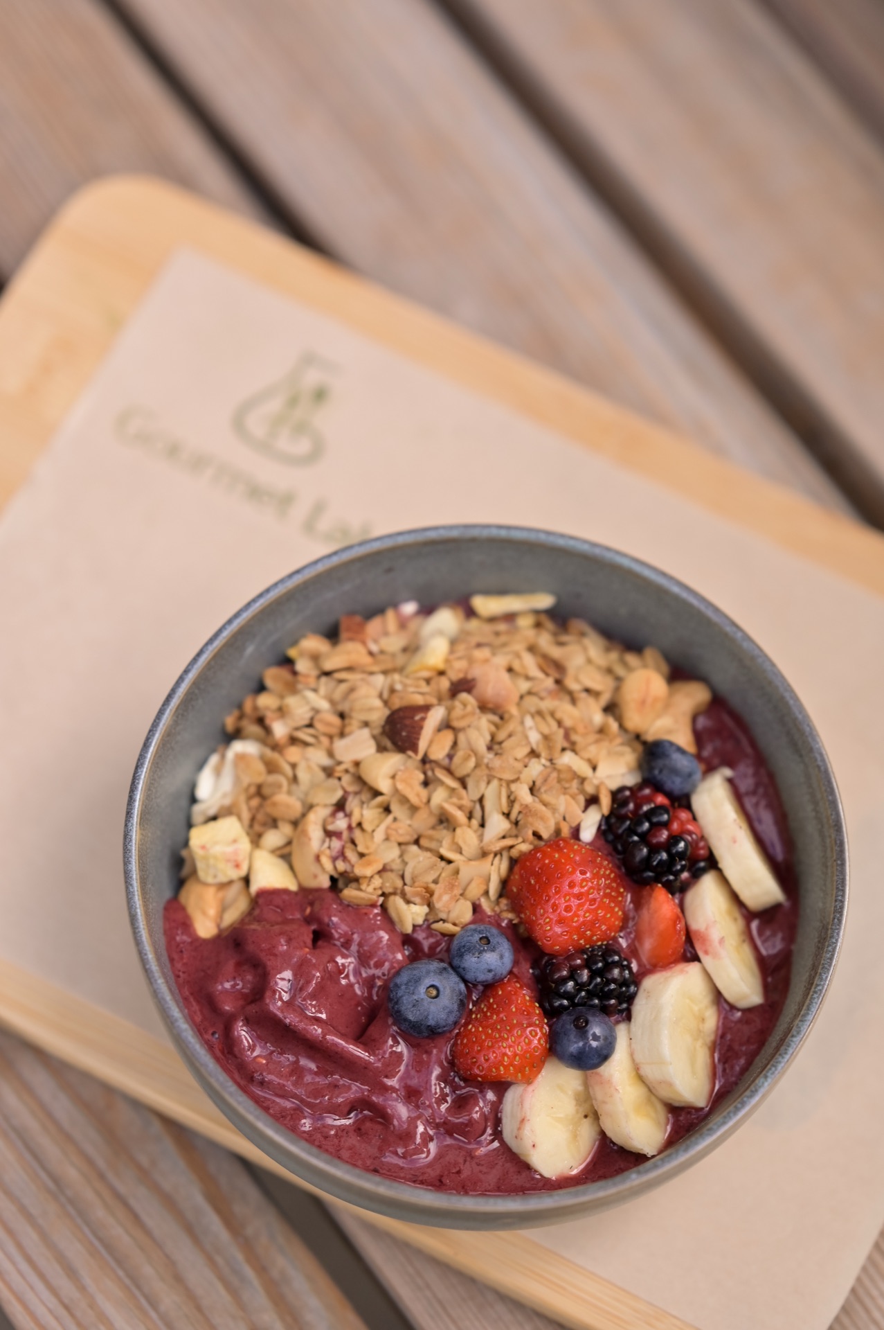 Acai bowl with berries and granola from above
