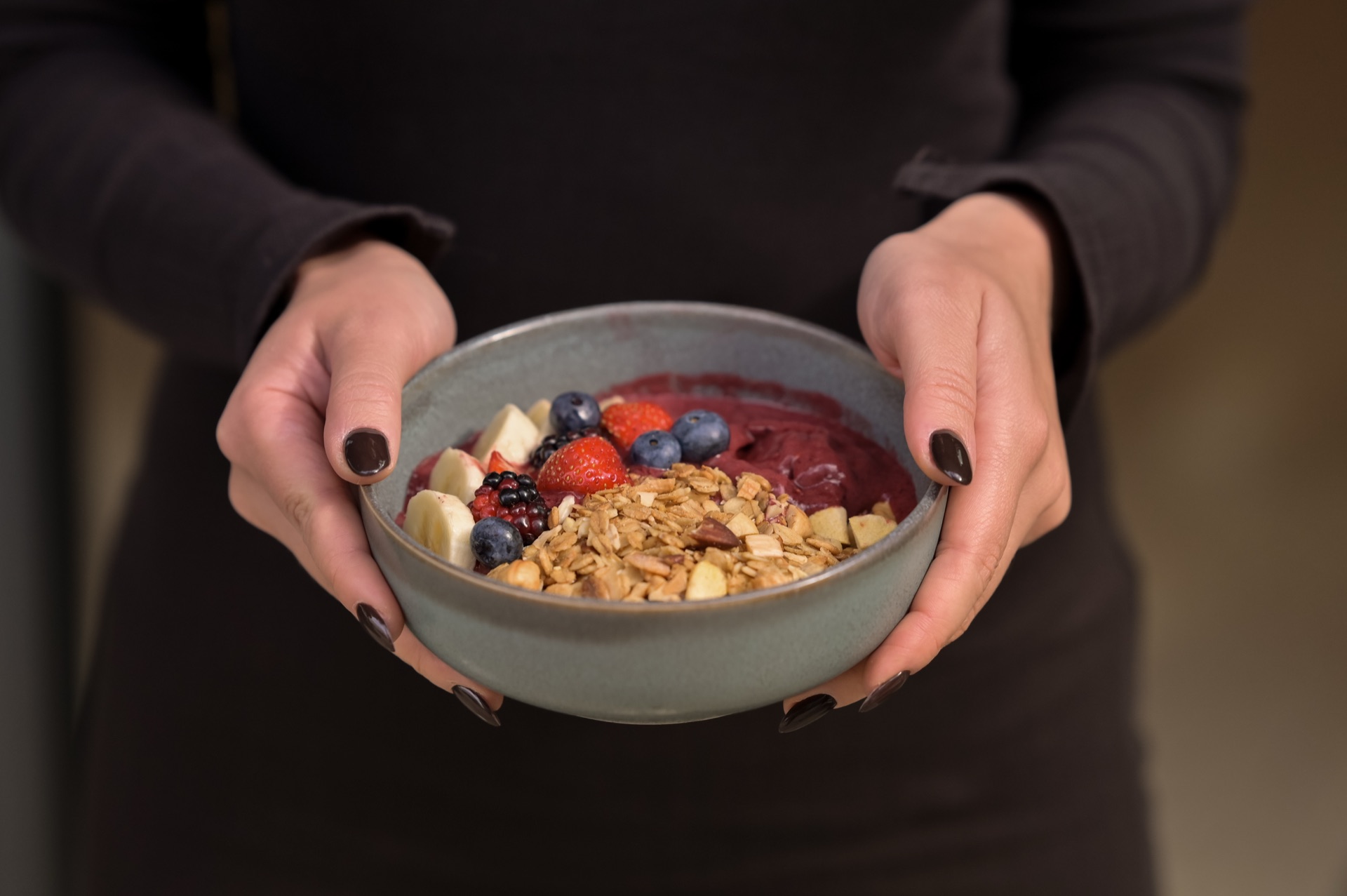 Fresh smoothie bowl with berries and granola
