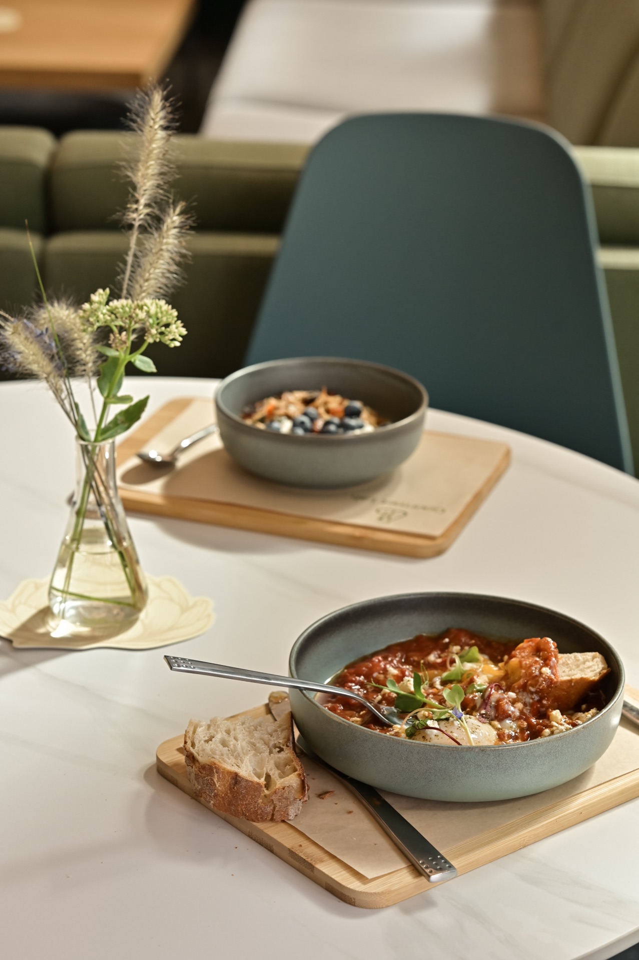 Breakfast table with shakshuka and granola